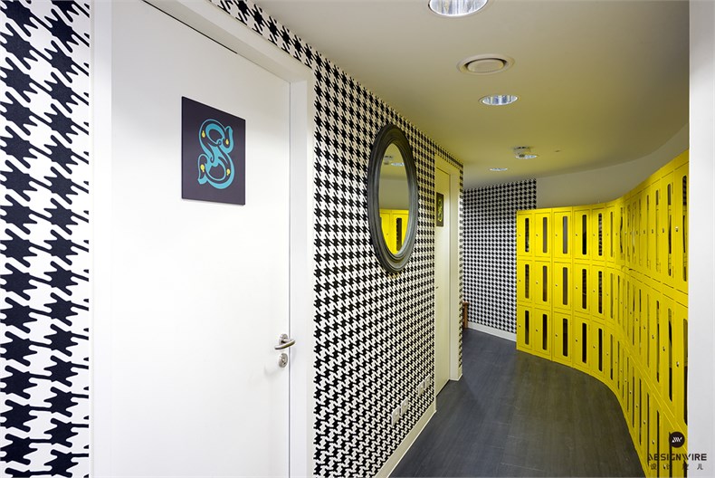 27. Entrance to staff shower and bathrooms with dog-tooth wallpaper and lockers for changes of shoes for evening wear.jpg